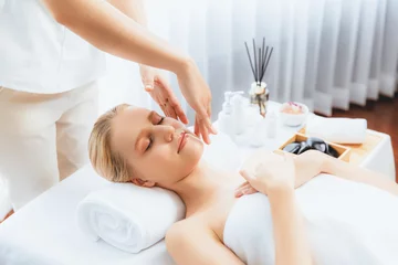 Poster Caucasian woman enjoying relaxing anti-stress head massage and pampering facial beauty skin recreation leisure in dayspa modern light ambient at luxury resort or hotel spa salon. Quiescent © Summit Art Creations