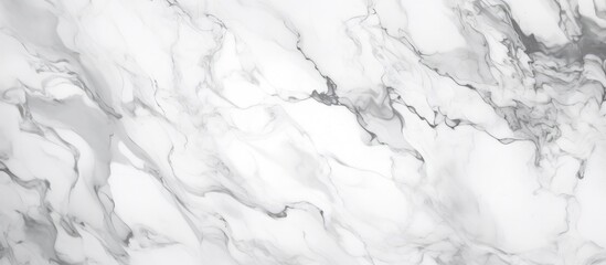 Detailed view of a luxurious white marble texture with intricate veining and patterns. The smooth surface reflects light, creating a sophisticated and elegant aesthetic.