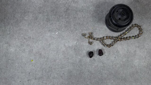 concept of the holy month of Ramadan, Classic lantern with candle and Ajwa dates fruits on grunge background