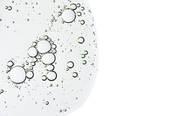 The texture of a body serum or cosmetic oil with bubbles. Liquid skin care product. Copy space.