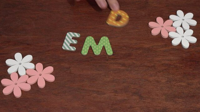 Female hand arranging the letters EMDR. Eye Movement Desensitization and Reprocessing psychotherapy treatment concept.