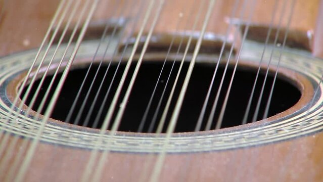 The Guitarron Chileno (literally: "large Chilean guitar"), a Guitar-shaped Plucked String Instrument from Chile. Close Up.