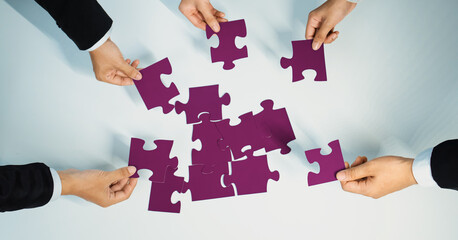 Top view panorama banner of business team assembling jigsaw puzzle over table symbolize business partnership and collective teamwork for HR recruitment and job seeker background. Shrewd