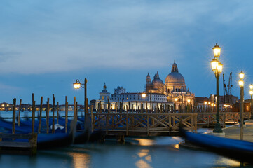Fototapeta premium Nice view of the Gondola docking pier in Venice at sunset