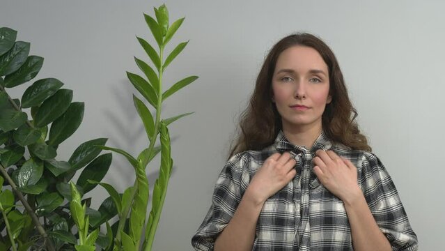 Person practicing EFT. Female tapping inner collarbone (CB) meridian point. 