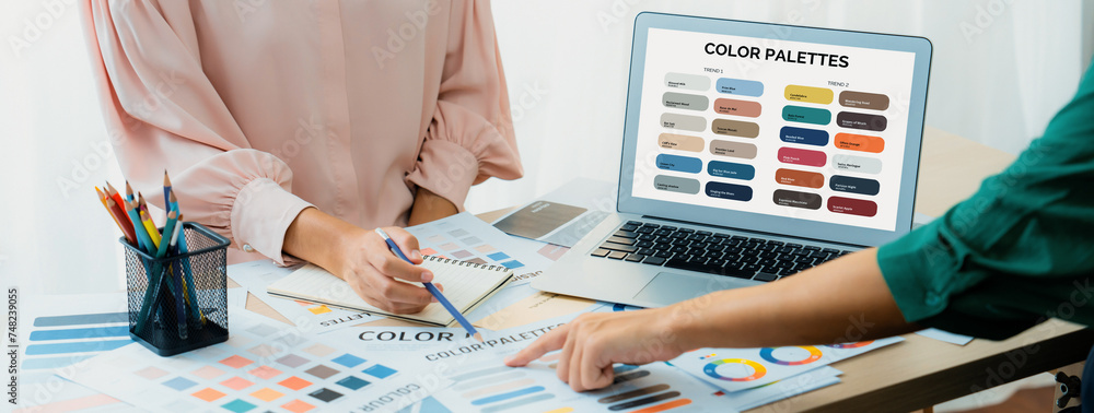 Poster creative graphic design presents selective color while manager using laptop comparing suitable color