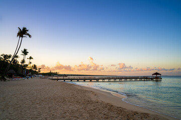 Wooden dock and shore at sunrise at Bayahibe beach, Dominican Republic - 748240446