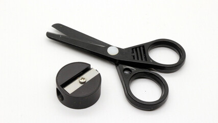Black scissors with and black pencil sharpener a small size