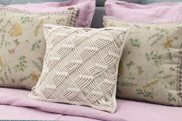 Soft sofa pillows for apartment interior design, close-up