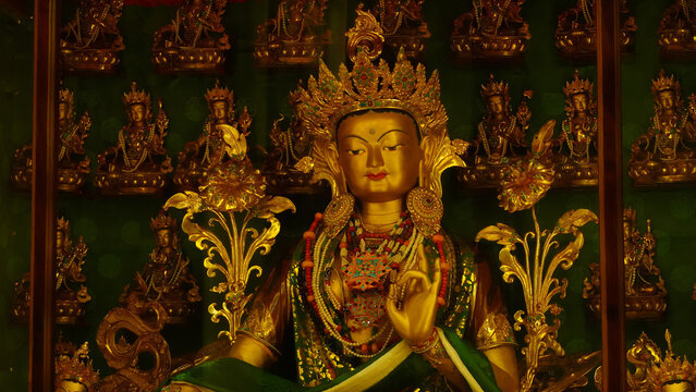 golden statue of maitreya buddha