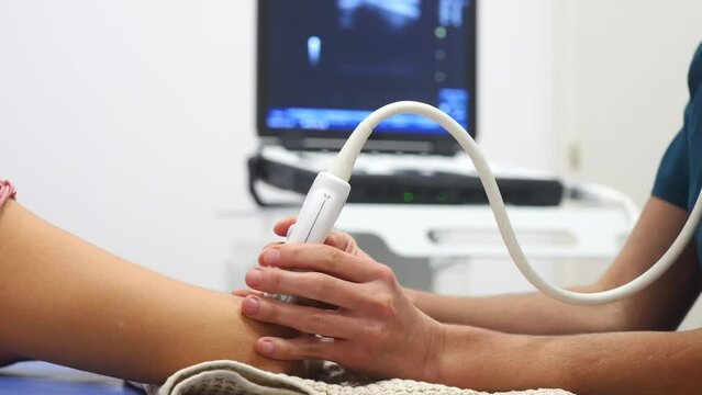 Healthcare professional conducting arm ultrasound exam