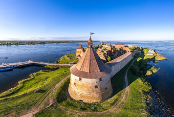 Europe. Russia, Leningrad region, St. Petersburg, Aerial panoramic view on fortress Oreshek near Schlesselburg town. Ancient Russian fort on island in Ladoga lake in sunny summery day - obrazy, fototapety, plakaty