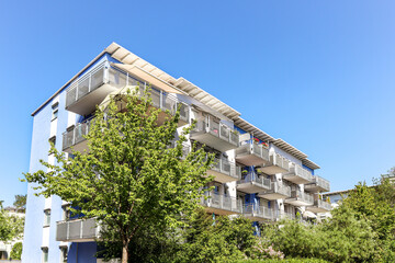 Residential area with ecological and sustainable green residential buildings, low-energy houses with apartments and green courtyard