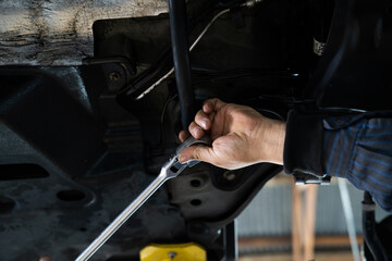 mechanic working in a car
