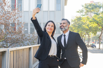 Colleagues taking a selfie outside the office