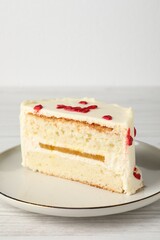 Cut bento cake on white wooden table, closeup. St. Valentine's day surprise