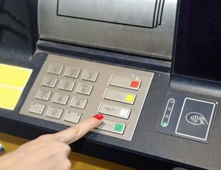 Finger with Nail Polish Types Security Code on Numeric Keypad