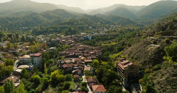 Aerial view Kakopetria Cyprus cityscape. Landscape of a tourist village in the mountains of the island with old houses and architectural monuments. High quality 4k footage