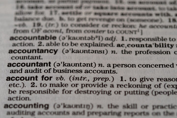 Macro close-up image of a dictionary showing the word Accountant and a description of the word 