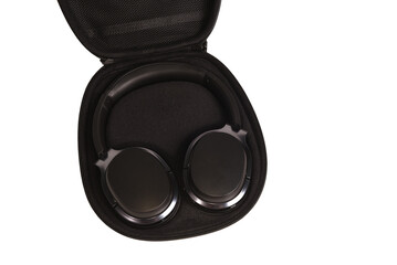 Black Wireless modern Headphones in a black earphone case on a white isolated background