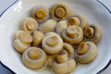 Champignon mushrooms in brine. Canned champignon mushrooms whole