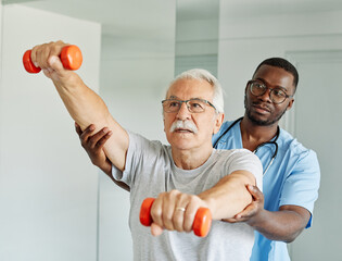 therapist senior home exercise exercising patient physical therapy care nurse recovery dumbbell physiotherapy fitness stretching training coach support nurse - 748268451