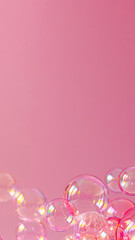 Delicate Dance of Pink Soap Bubbles: Light and reflections play across translucent surfaces against a soft pink backdrop. A moment of fragile beauty captured in vibrant clarity