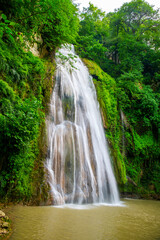 Fototapeta na wymiar Lush Greenery Framing Lowe Waterfall, Loveh, Golestan Province, Iran