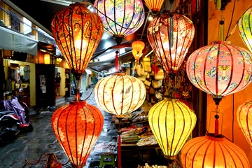 Fotobehang Brightly coloured lanterns filled with light © fivepointsix