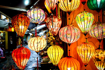 Brightly coloured lanterns filled with light
