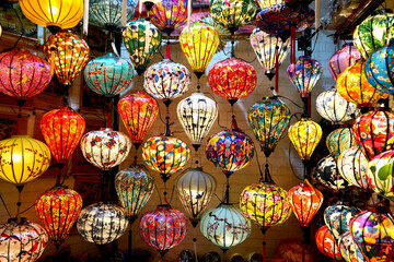 Brightly coloured lanterns filled with light
