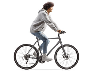 Guy wearing jeans and riding a bicycle