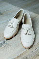 Women's beige loafers without a heel for every day. Collection of summer women's shoes. Stylish women's shoes for the summer