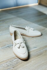 Women's beige loafers without a heel for every day. Collection of summer women's shoes. Stylish...