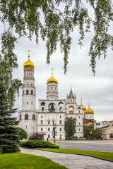 Fototapeta na wymiar Ivan the Great bell tower and Dormition cathedral from Moscow Kremlin garden.