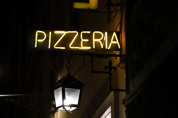 Neon sign of a pizzeria in Florence, Italy