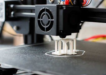 3D printer with white model, close up