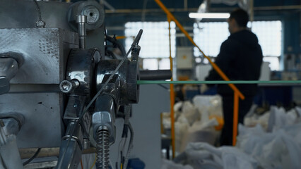 Cable production process, mechanism in a cable factory. Creative. Stretching cable and machinery.