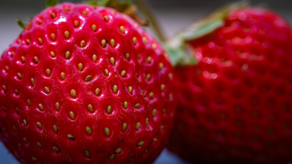 Close up of fresh strawberries showing seeds achenes. Details of fresh ripe red strawberries.