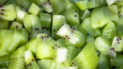 Ripe kiwi fruit. Detail of chopped exotic kiwi fruits used for desserts