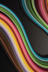 Color strip gradient rainbow wave on black grain paper. Abstract texture background.