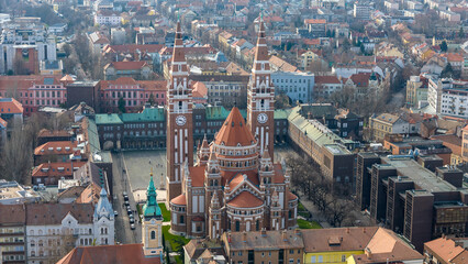 Fototapeta na wymiar Drone footage from downtown of Szeged, Hungary on a sunny winter day. Szeged, Drone, Aerial, Hungary, Urban Landscape, Szeged Cathedral, Tisza River, Bridge