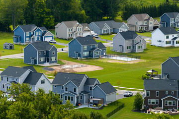 Housing market in the USA. Residential homes in suburban sprawl development in Rochester, New York. Low-density two story private houses in rural suburbs