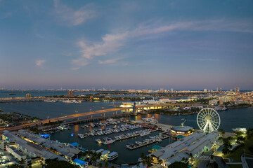 Luxury yachts docked in Biscayne Bay harbor in downtown district of Miami city in Florida, USA