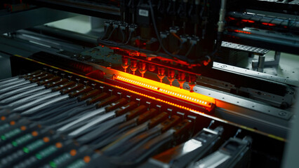 Obraz premium Electronic circuit boards production and installation of SMD components. Creative. Needle automatic equipment diagnose and test chips and processors.