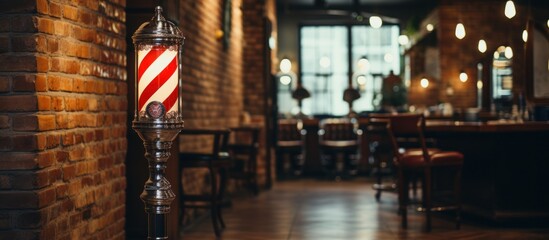 Rotating barber pole mounted on a brick wall