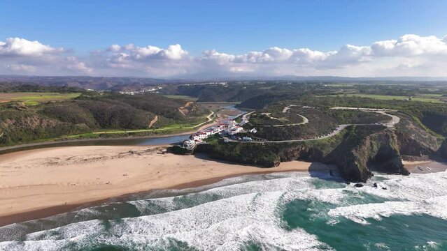 Drone flight from the ocean towards Odeceixe Mar Beach, Portugal