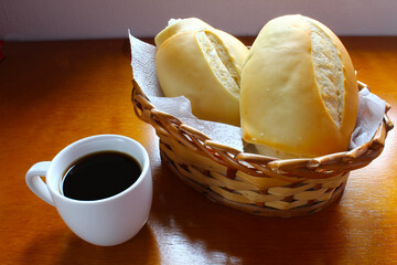 Brazilian breakfast. Coffee cup and bread basket.