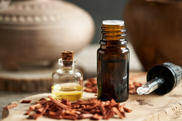 Bottles of aromatherapy essential oil with red sandalwood