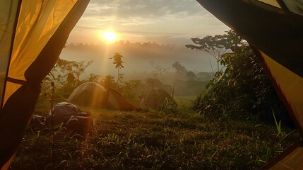 View from inside tent at a campsite, as the stunning sunrise casts its warm glow over jungle landscape adorned with of the rainforest blanketed in beautiful morning fog, for camping. AI generation